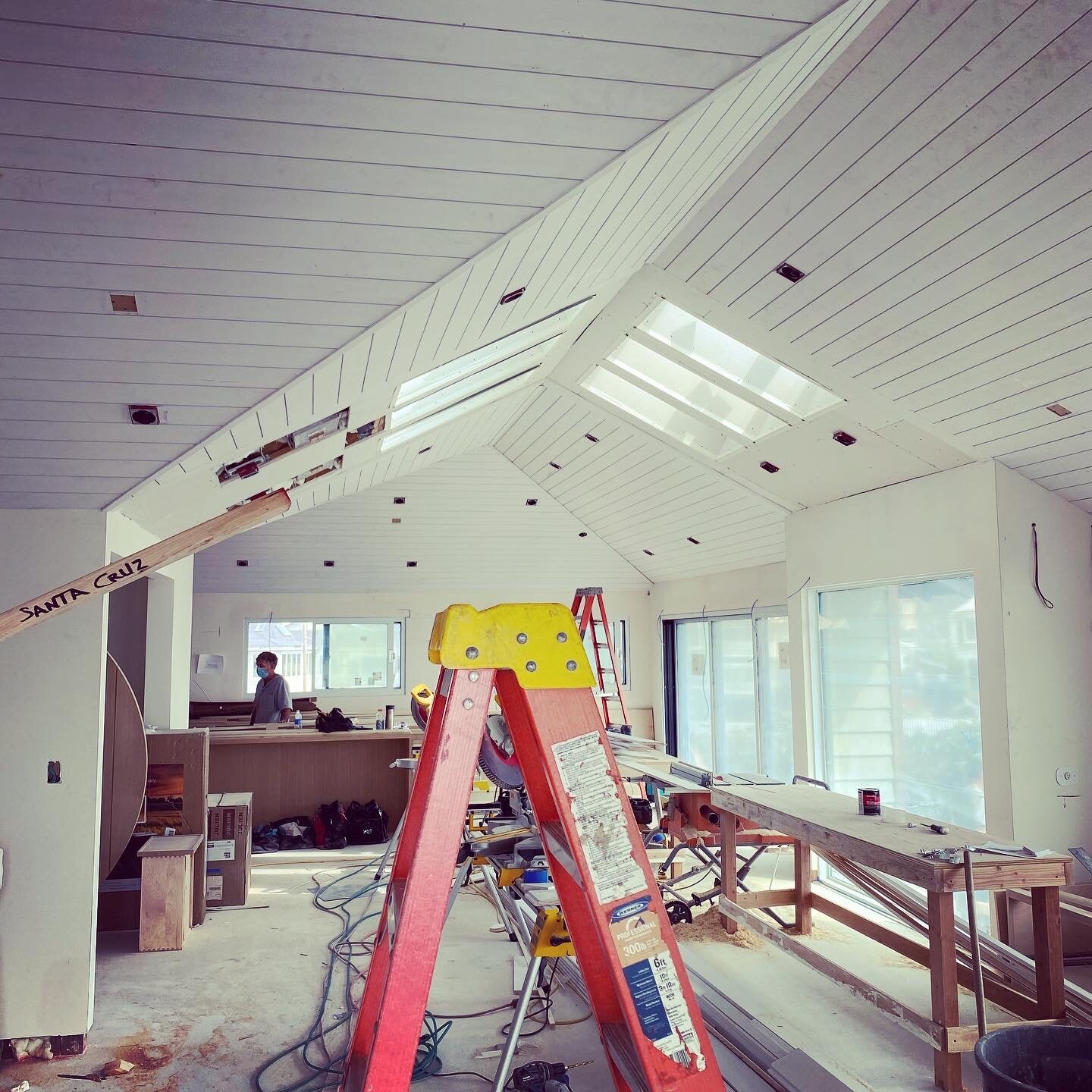 Detailed tongue-and-groove ceiling work with skylights